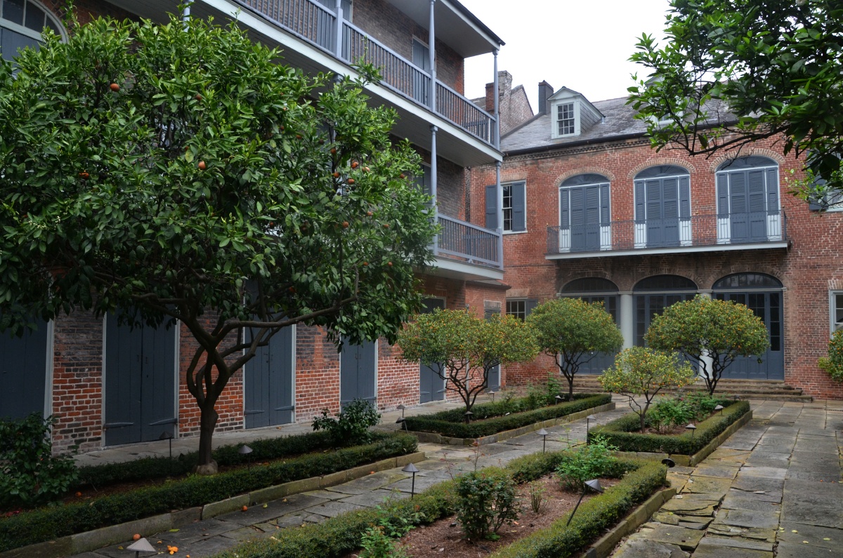 A French Quarter residence with slave on the left and owners in main building