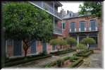 A French Quarter residence with slave on the left and owners in main building